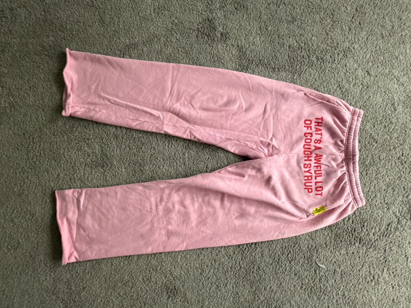 Customer photo review of Awful Lot of Cough Syrup Pink Red Spellout Sweatpants