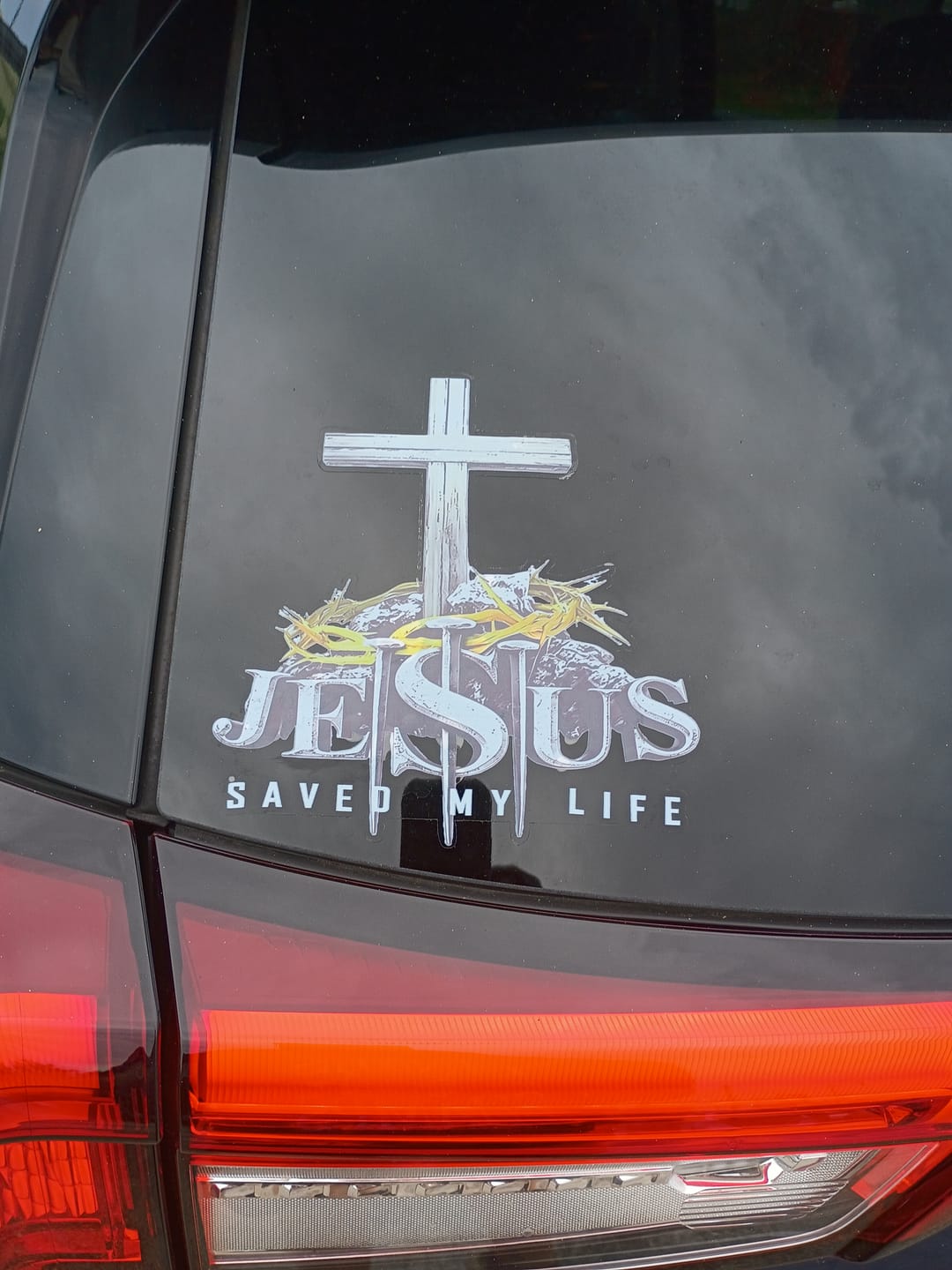 Customer photo review of Christianartworkshop Cross Crown of Thorns Nails JESUS SAVED MY LIFE Waterproof Car Sticker: A Symbol of Redemptive Sacrifice