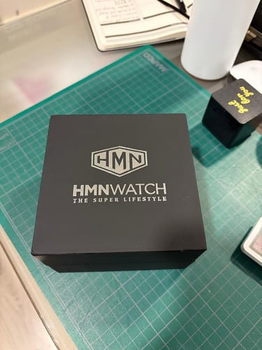 Customer's HMN Boxster Spyder 718 watch box, closed, sitting on a green cutting mat.