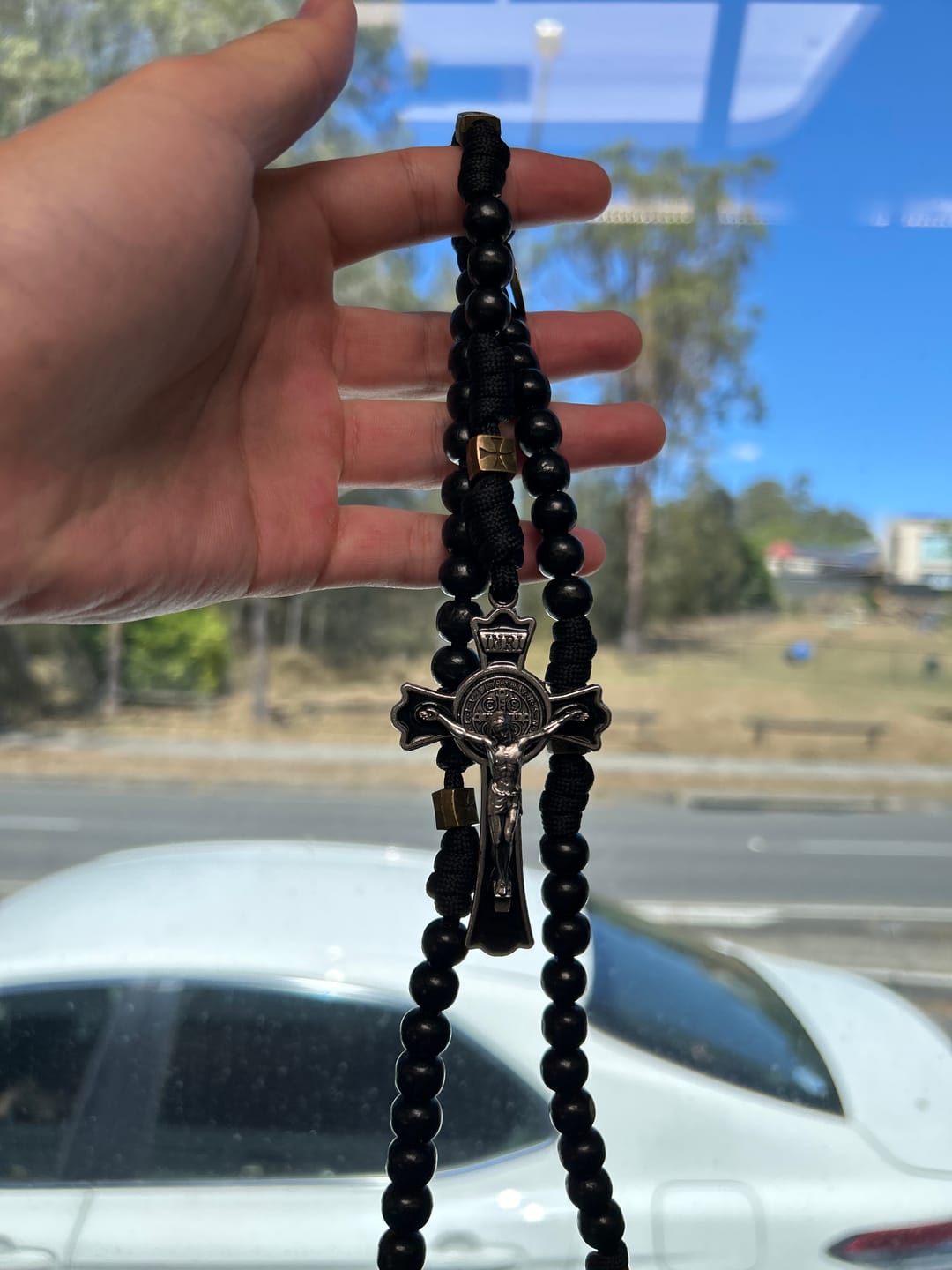 Customer photo review of SolaceBeads Black Wood Paracord Rosary with Medal & Crucifix: Rooted in St. Benedict Protection