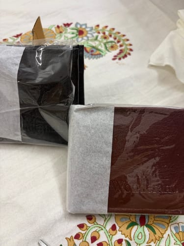 Customer's ZIORO Spiderman wallet and an unopened, different brand brown wallet inside their packaging