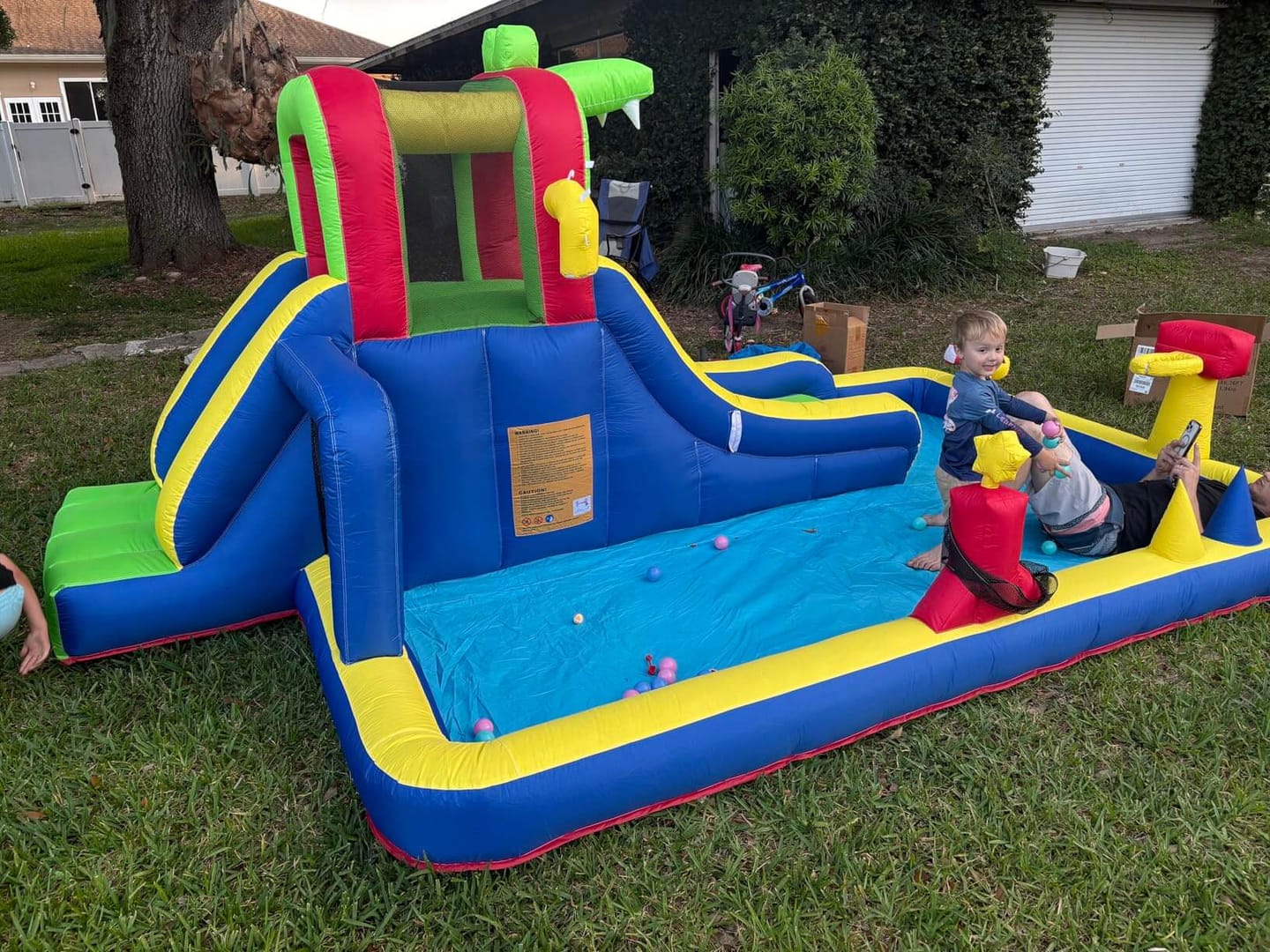 Customer photo review of 15ft Mini Bounce House with Splash Pool Water Park for Kids with Blower