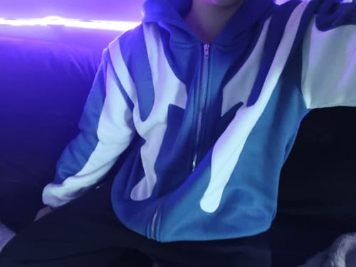 Customer's blue and white Sweat Y2K zip-up hoodie with a casual, oversized fit.