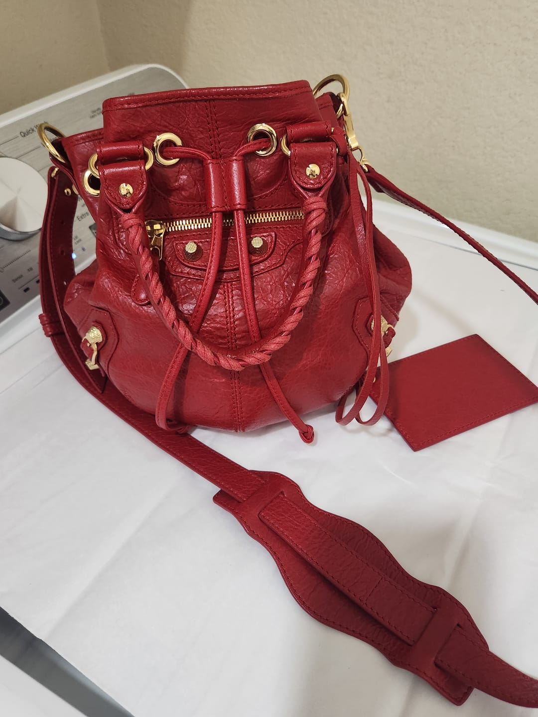 Customer photo review of Giant 12 Mini Pompon Red Leather Bucket Crossbody Bag