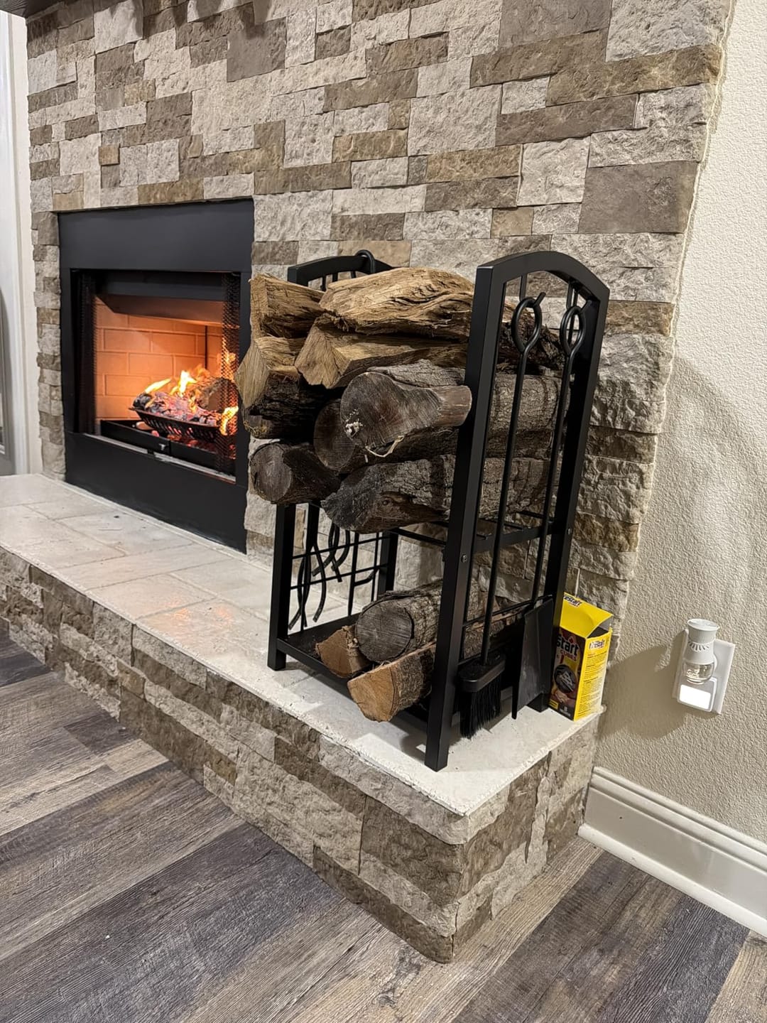 Customer photo review of Firewood Log Rack with Tools | 29 in Wrought Iron Holder with 2 Shelves | Poker, Shovel, Brush and Hook Set