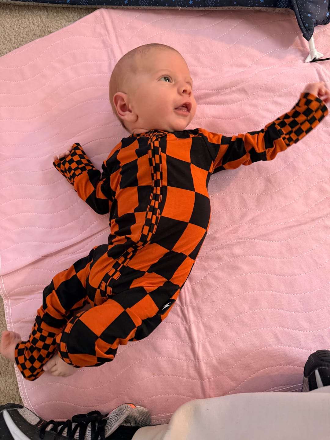 Customer photo review of Bamboo Zippy Sleeper in Jack-O Lantern Checkered