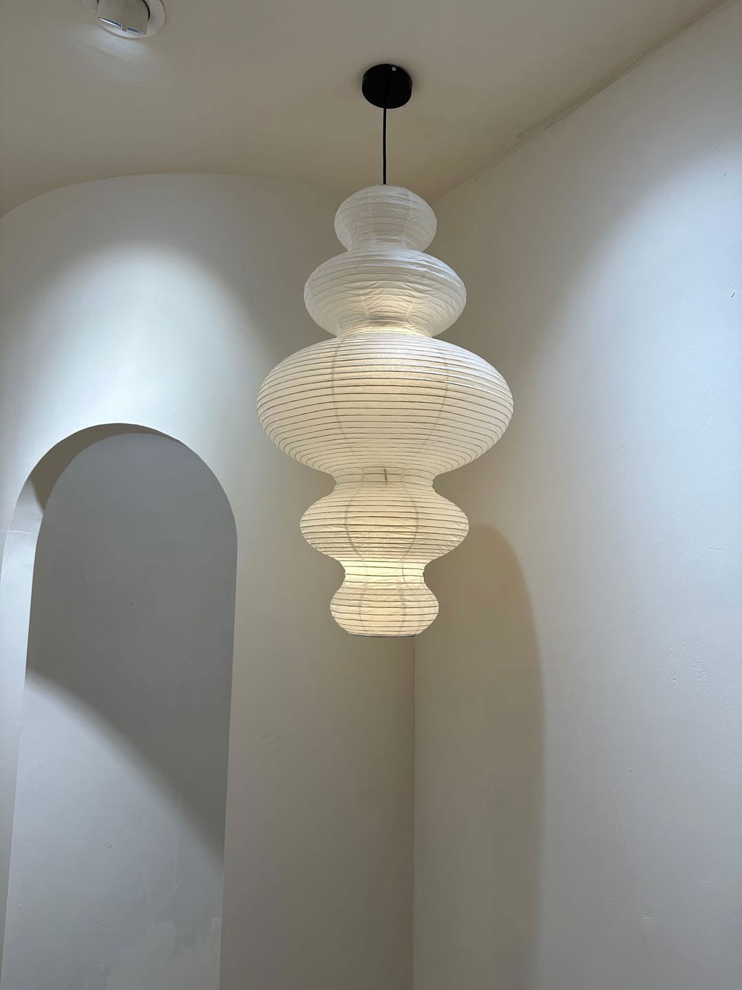 Customer photo review of Rice Paper Pendant Light | 18.5 x 32 in Sculptural Paper Shade on a Bamboo Frame | Plug-In, 15 ft Cord, E26
