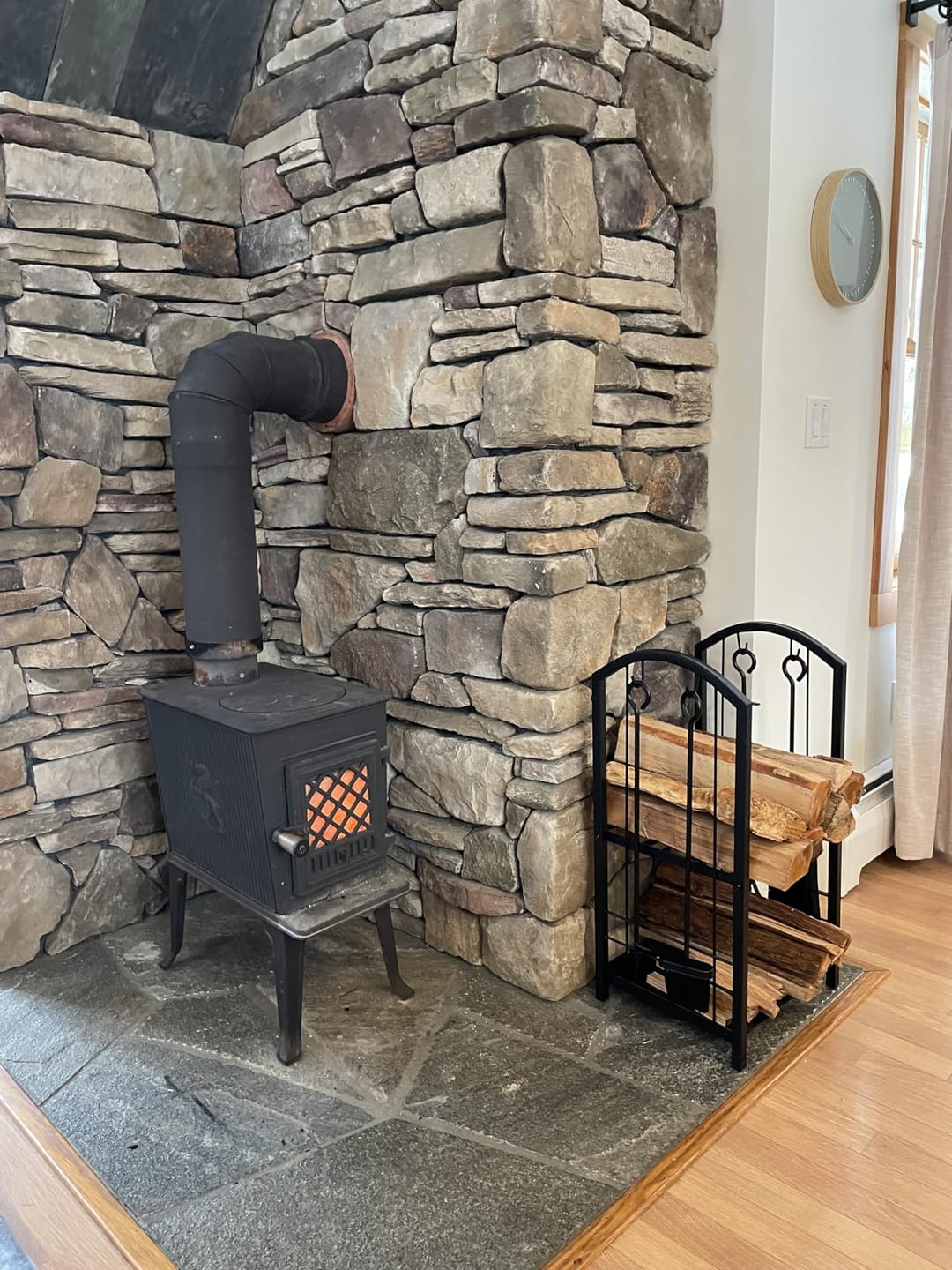 Customer photo review of Firewood Log Rack with Tools | 29 in Wrought Iron Holder with 2 Shelves | Poker, Shovel, Brush and Hook Set