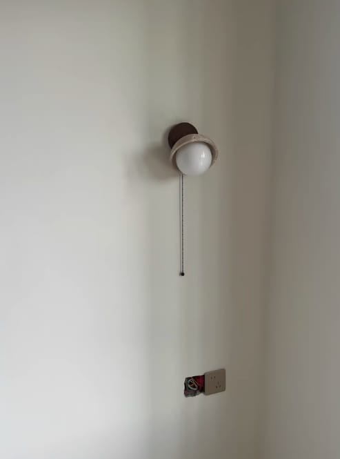 Customer photo review of Travertine Dome Wall Light, Wood Backplate, Pull Chain, Wall Sconce