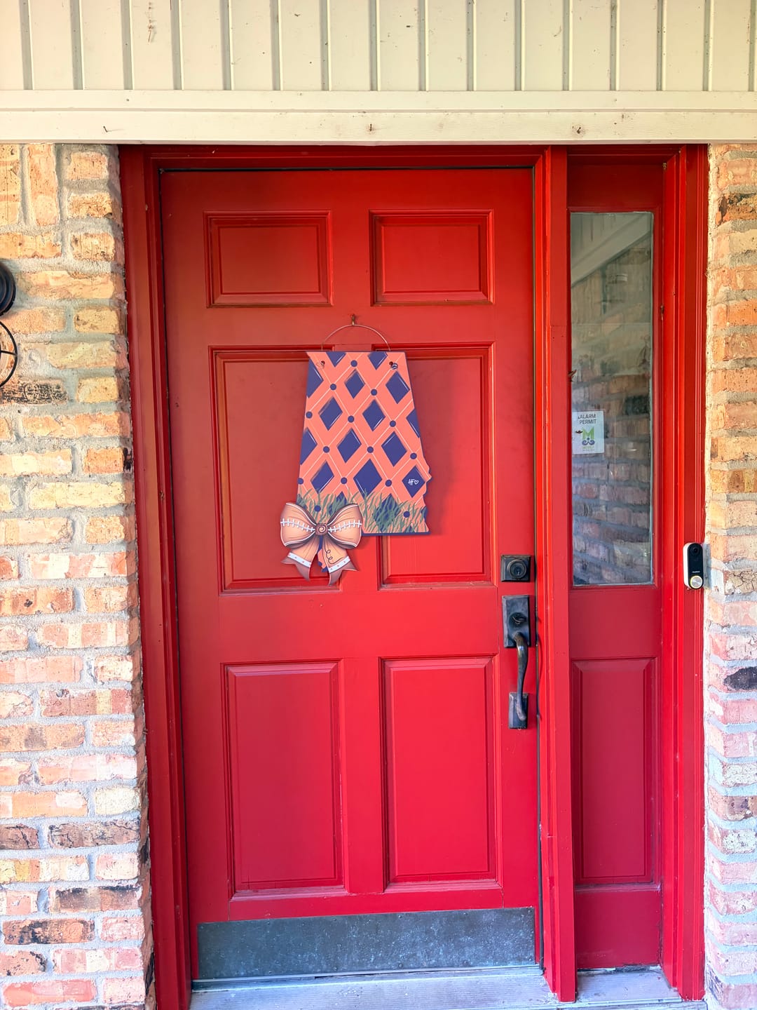 Customer photo review of Navy and Orange Alabama Football Bow Door Hanger