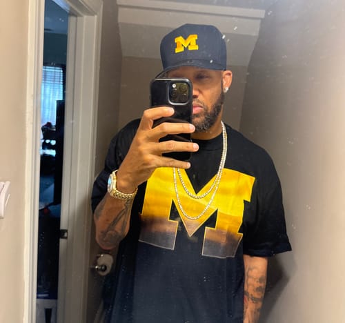 Reviewer wearing a 14K Gold IP Classic 4MM CZ Tennis Chain, taking a selfie in a mirror.