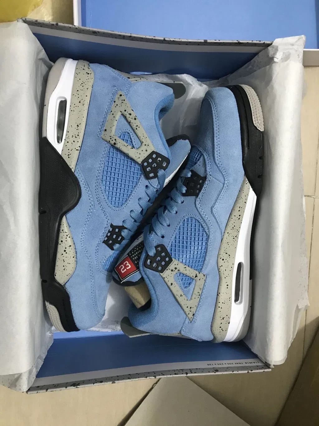 Customer photo review of Air Jordan 4 Retro “University Blue”