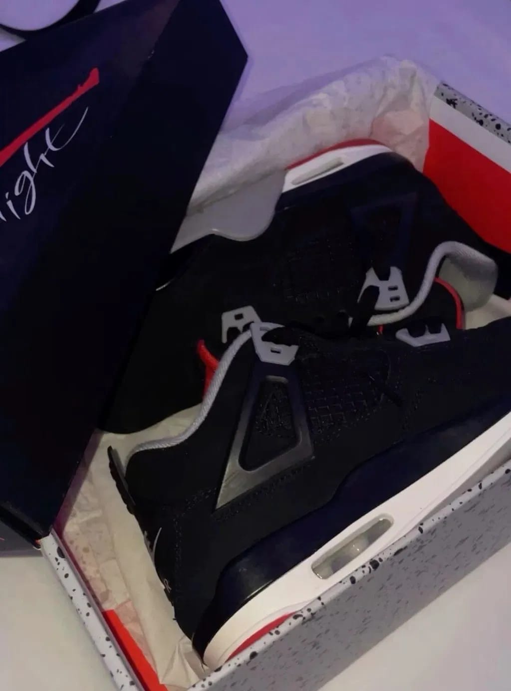Customer photo review of Air Jordan 4 Retro “Bred”