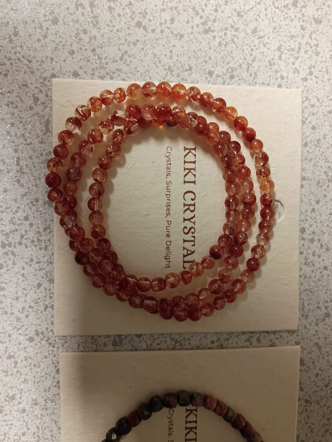 Customer photo review of Fire Quartz Triple Wrap Bracelet 4.4-4.7mm
