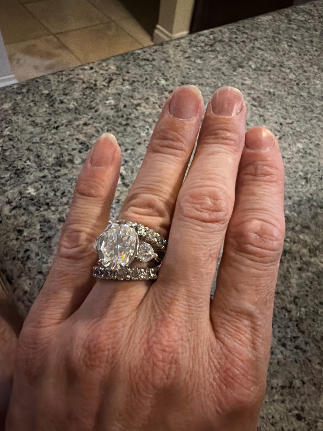 Customer photo review of Breathtaking Three-Stone Pave Oval Cut 10.0ct Engagement Ring