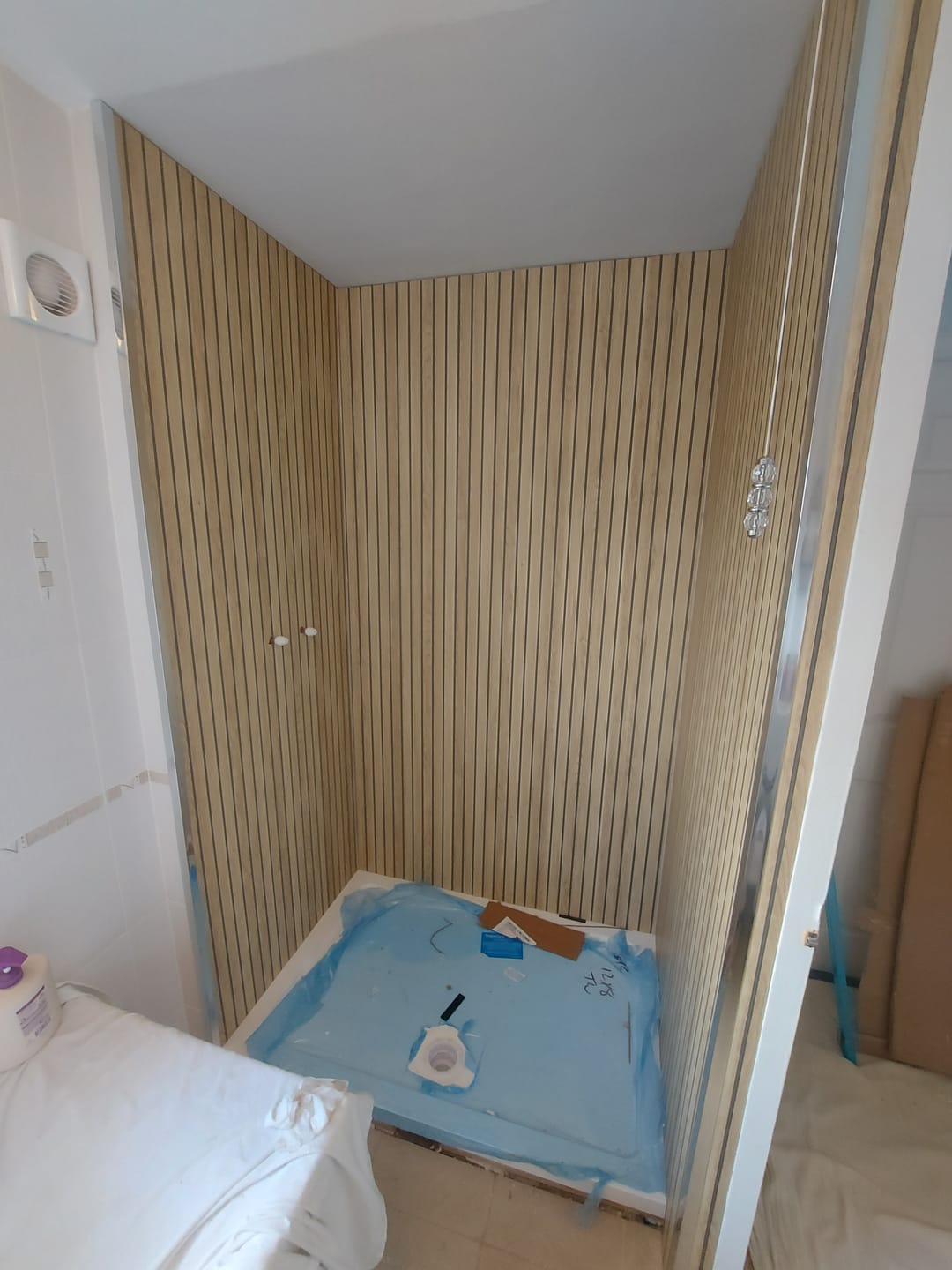 Customer photo review of Sivara Oak Slatted Wood Effect PVC Waterproof Shower Panel