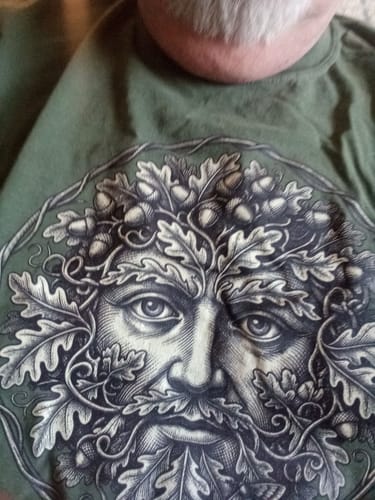 Customer's green Green Man T-Shirt featuring a detailed leafy face design with acorns.