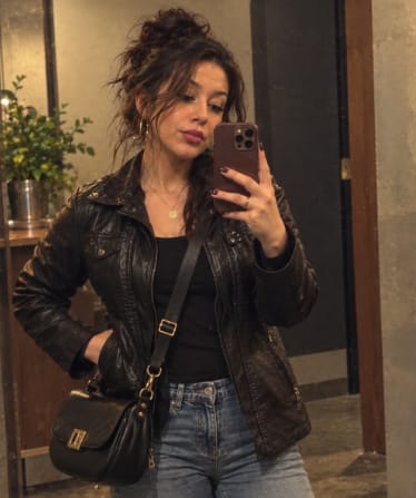 Customer photo review of Women's Faux Leather Jacket with Detachable Hood Motorcycle Biker Jacket Full Zipper Pleated Casual Warm Jacket