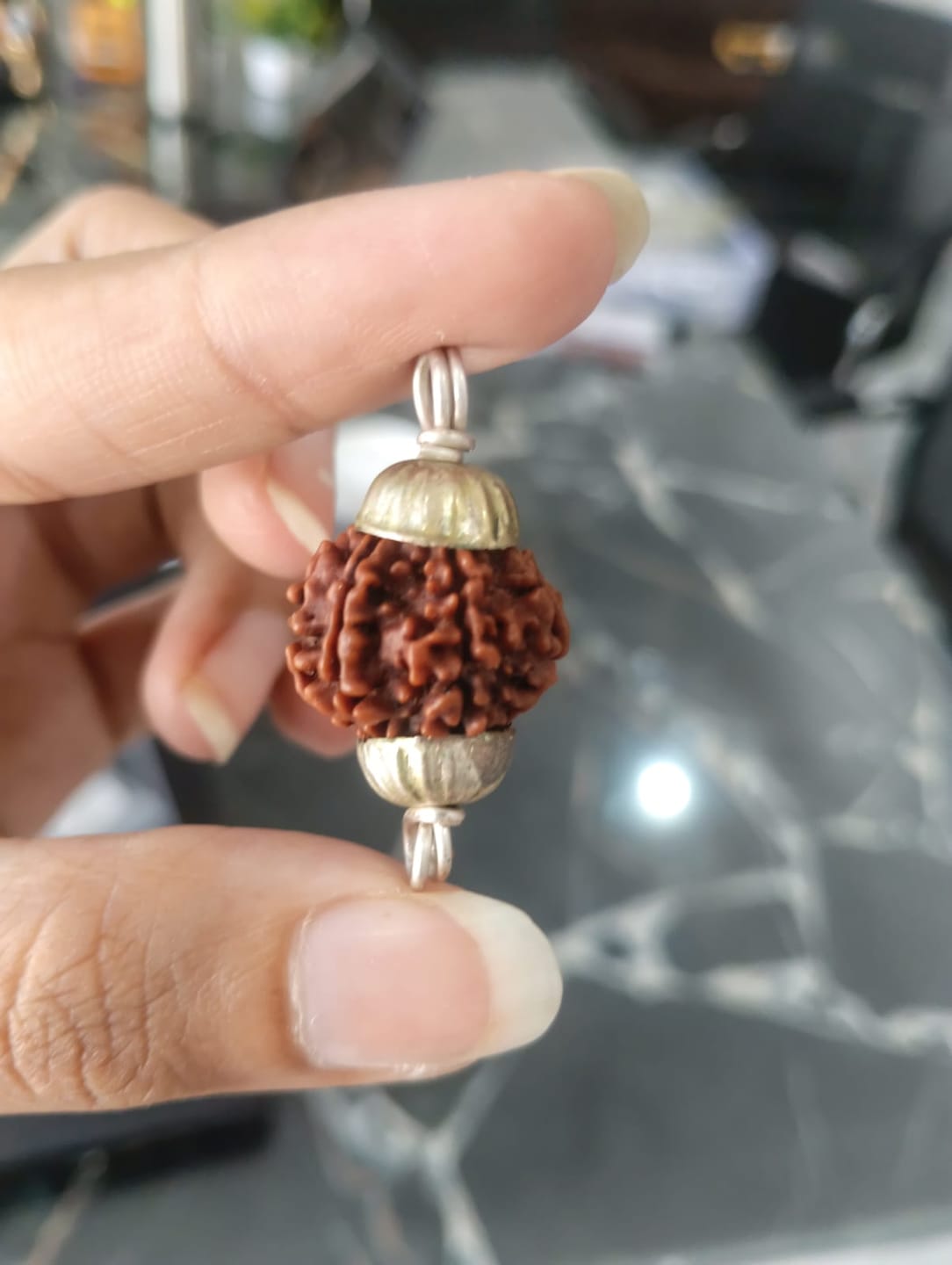 Customer photo review of Nepal Origin 7 Mukhi Rudraksha – 100% Natural & Certified