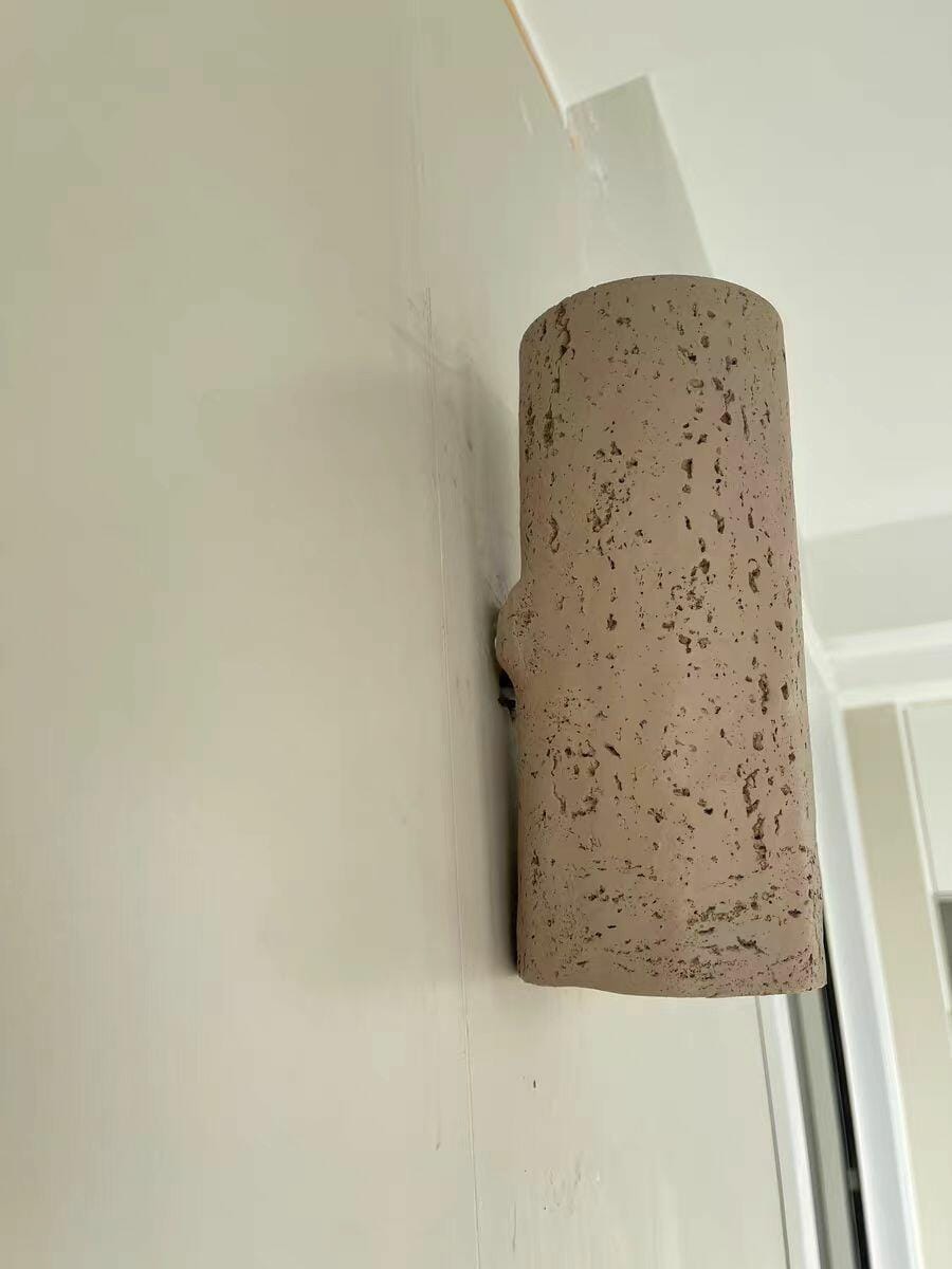 Customer photo review of Up and Down Travertine Wall Light, Cylinder, Wall Sconce