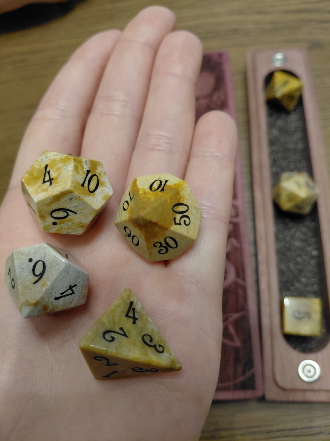 Customer photo review of URWizards D&D Coral Fossil Gemstone Engraved Dice Set