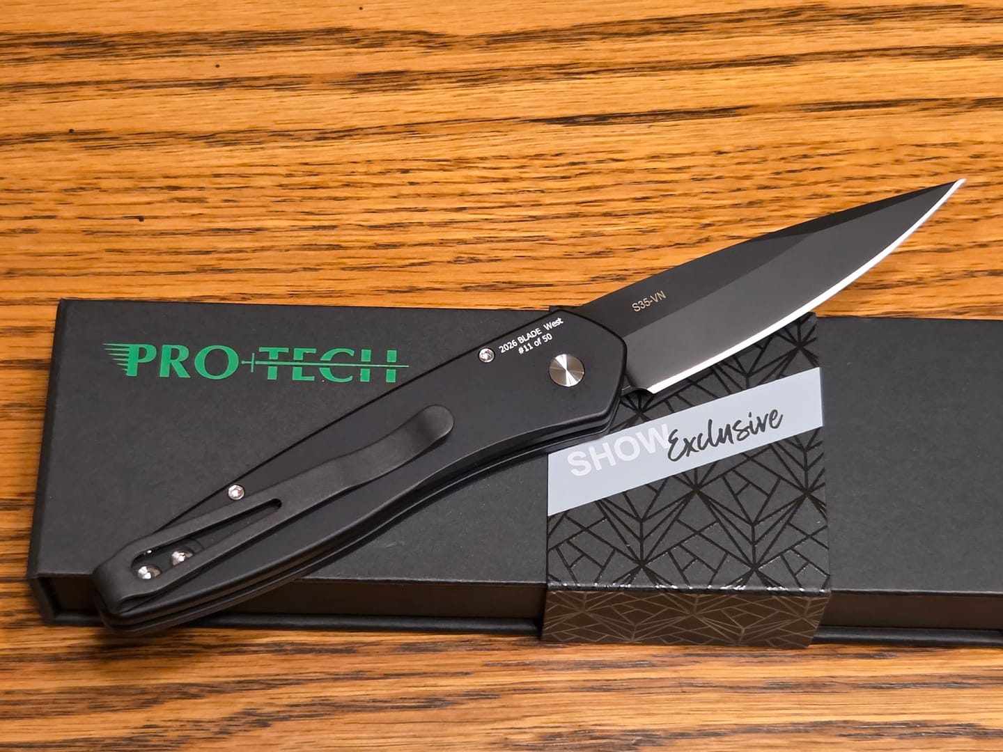 Customer photo review of Pro-Tech Newport, Blade Show West 2026 Exclusive, DLC Black S35VN, Abalone Button, Black Handle - Made in USA (BSW26.Newport.1)