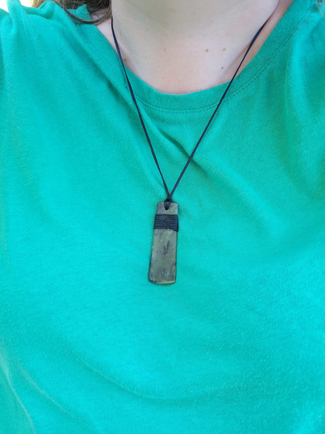 Customer photo review of Genuine Ngai Tahu Pounamu Wrapped Greenstone Toki Necklace 6cm