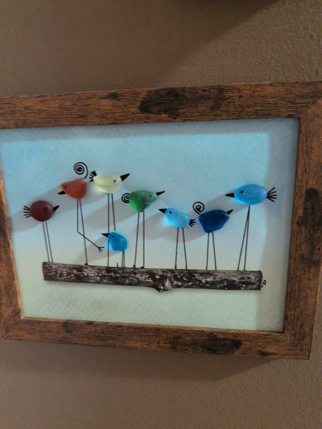 Customer photo review of Whimsical Rainbow Bird Flock Gathering Sea Glass Framed Art