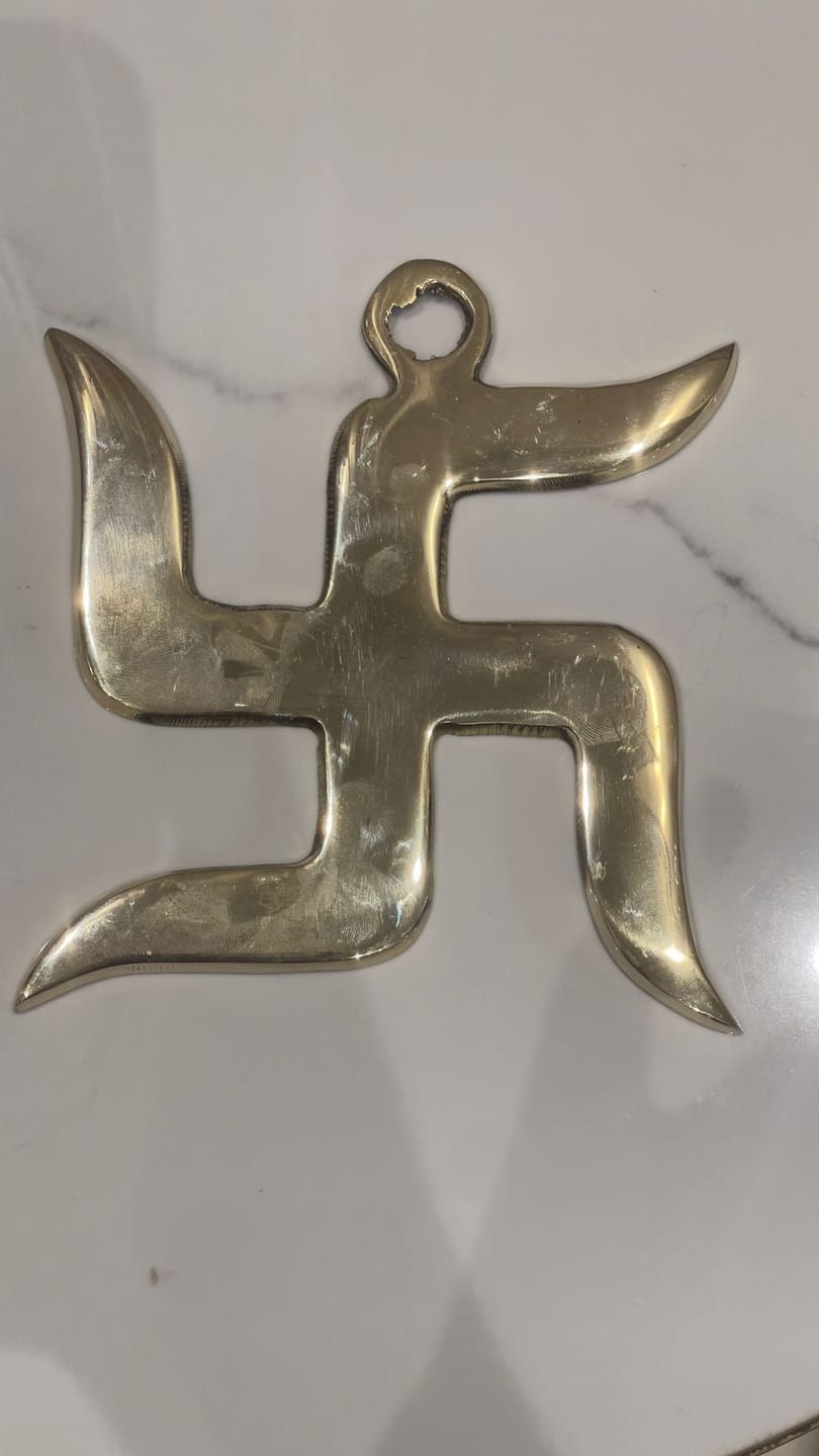 Customer photo review of Brass Swastik Wall Symbol | Vastu Remedy for Main Entrance & Auspicious Energy | 5 & 9 Inch