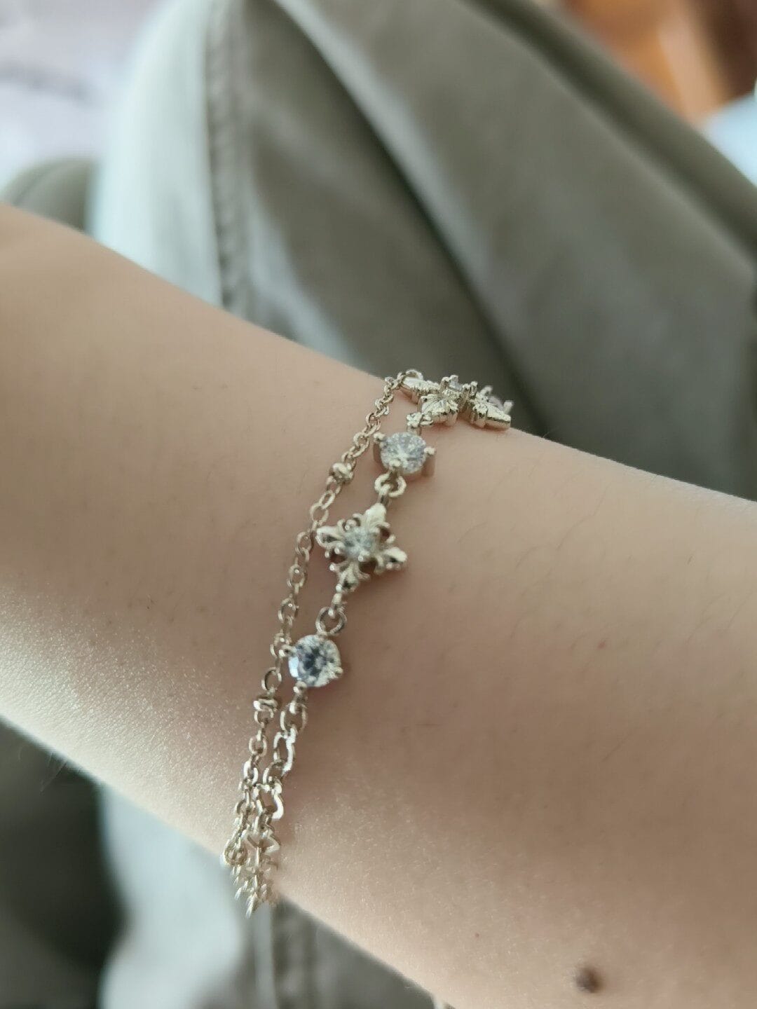 Customer photo review of "Bastet" 14K Gold Plated Layered Iris Zirconia Charm Bracelet