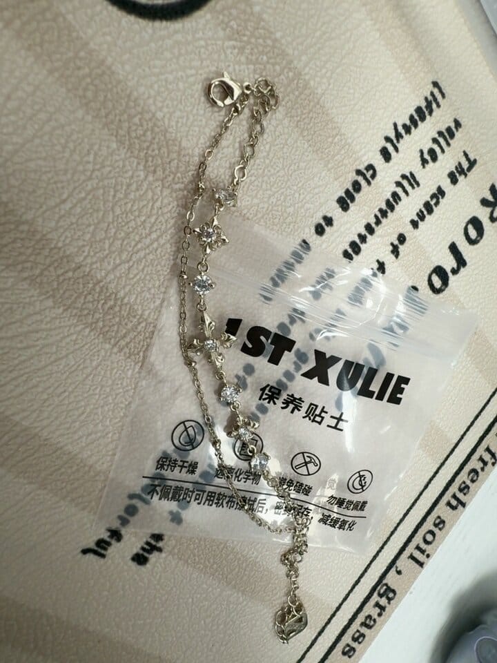 Customer photo review of "Bastet" 14K Gold Plated Layered Iris Zirconia Charm Bracelet