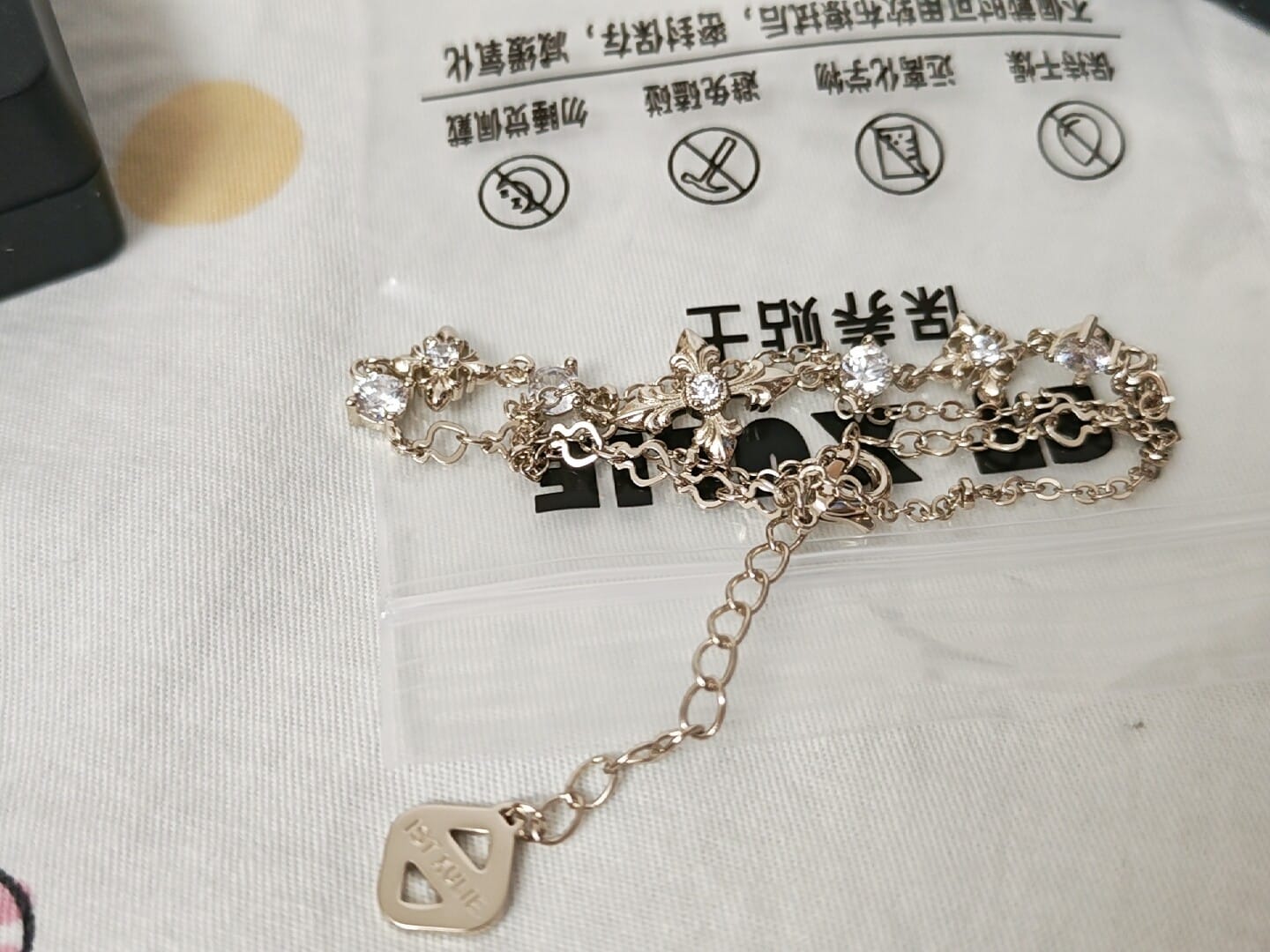 Customer photo review of "Bastet" 14K Gold Plated Layered Iris Zirconia Charm Bracelet
