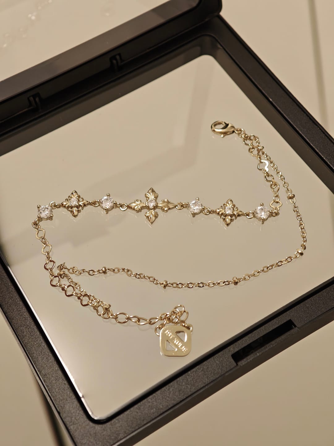 Customer photo review of "Bastet" 14K Gold Plated Layered Iris Zirconia Charm Bracelet