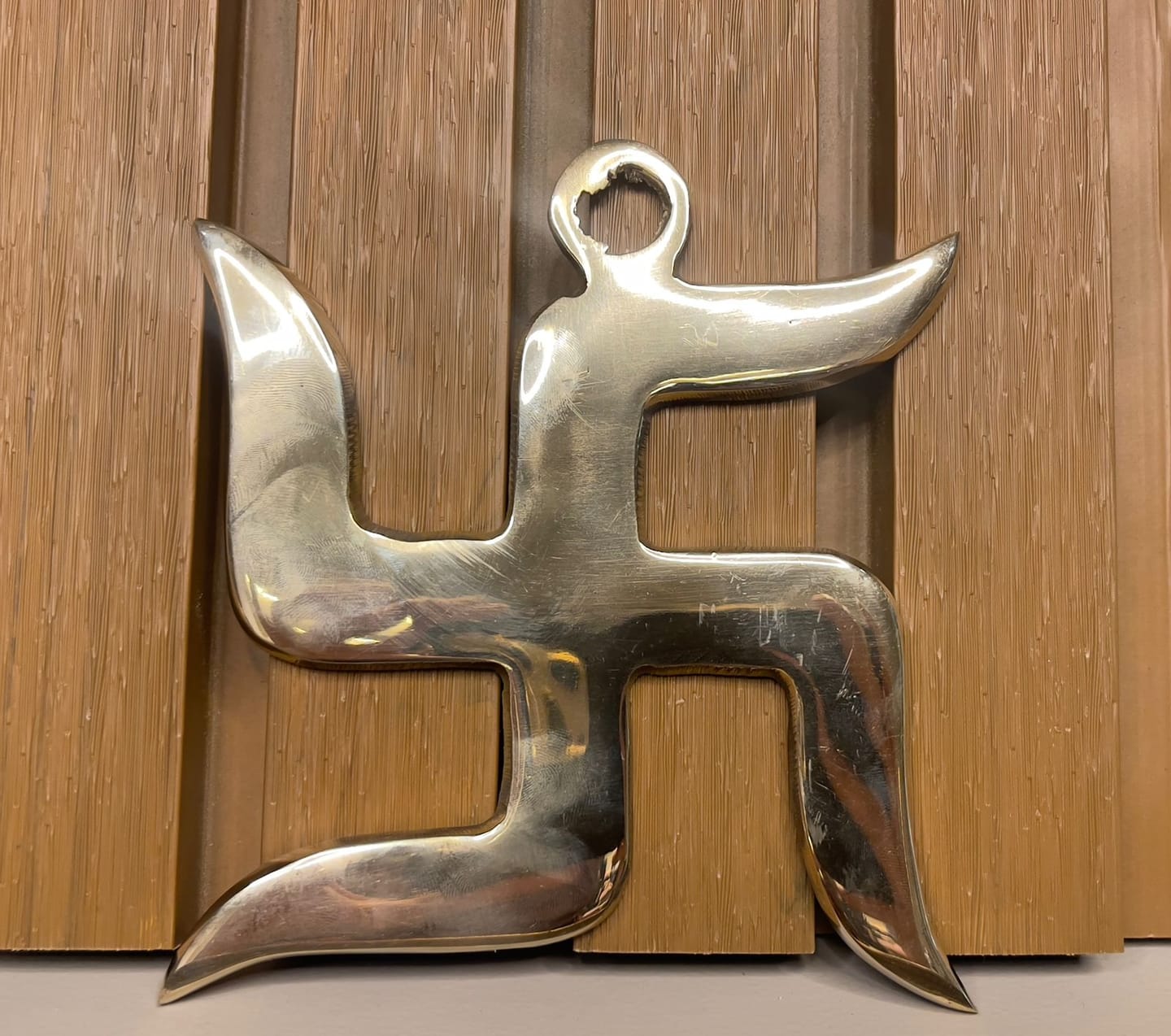 Customer photo review of Brass Swastik Wall Symbol | Vastu Remedy for Main Entrance & Auspicious Energy | 5 & 9 Inch