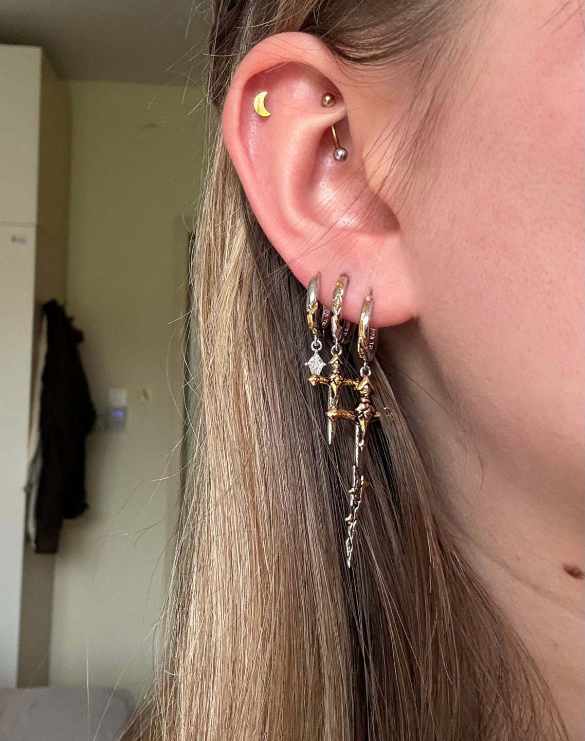 Customer photo review of "Knight's Oath" 18K Gold Plated Sword Dangle Hoop Earrings