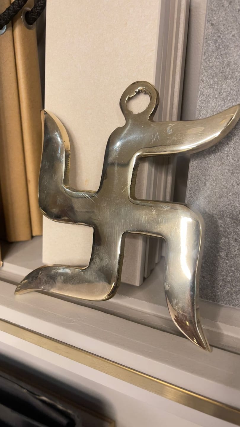 Customer photo review of Brass Swastik Wall Symbol | Vastu Remedy for Main Entrance & Auspicious Energy | 5 & 9 Inch