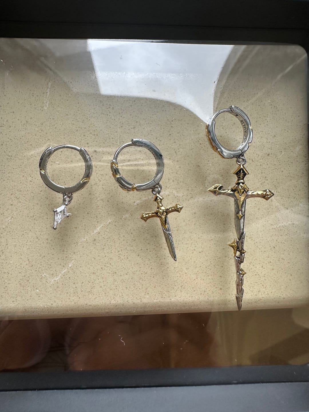 Customer photo review of "Knight's Oath" 18K Gold Plated Sword Dangle Hoop Earrings