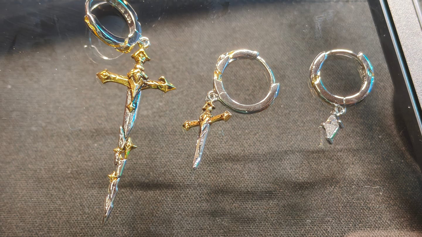 Customer photo review of "Knight's Oath" 18K Gold Plated Sword Dangle Hoop Earrings