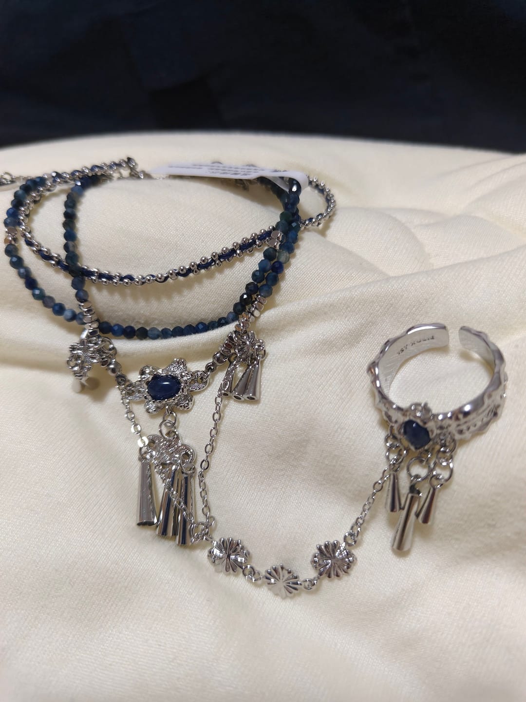 Customer photo review of "MIAO" Platinum Plated Blue Stone Hand Chain Bracelet