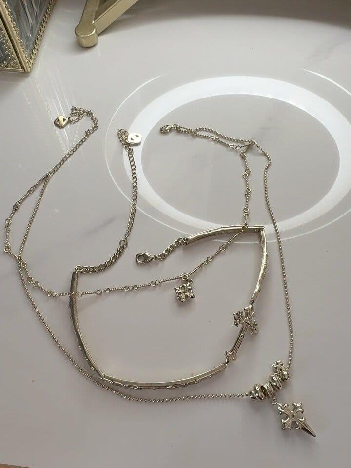 Customer photo review of "Bastet" 14K Gold Plated Iris Cross Pendant Necklace, Floral Statement Jewelry