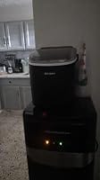 Customer photo review of Simzlife Portable Countertop Ice Maker, 26 Lbs/24H, 9 Bullet-Shaped Ice Cubes in 6 Minutes, Self-Cleaning Ice Machine, Red