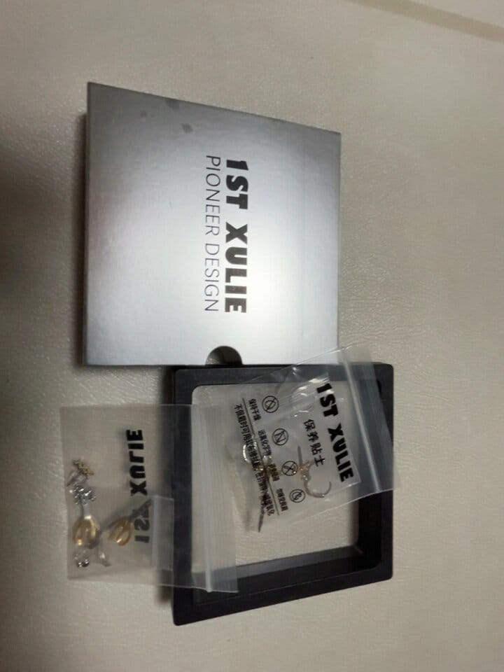 Customer photo review of "Knight's Oath" 18K Gold Plated Sword Dangle Hoop Earrings