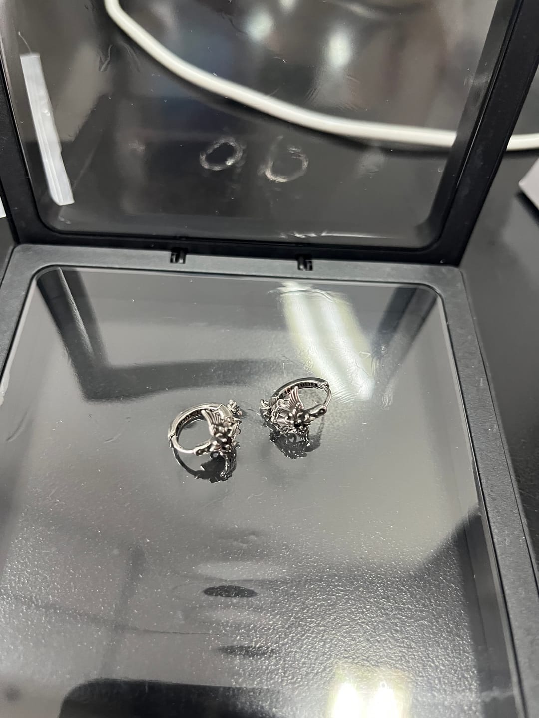 Customer photo review of "Irises" Platinum Plated Vintage Angel Wing Huggie Hoop Drop Earrings