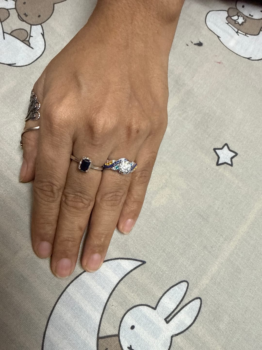 Customer photo review of Starry Night Moissanite Artistic Swirl Accent Engagement Ring