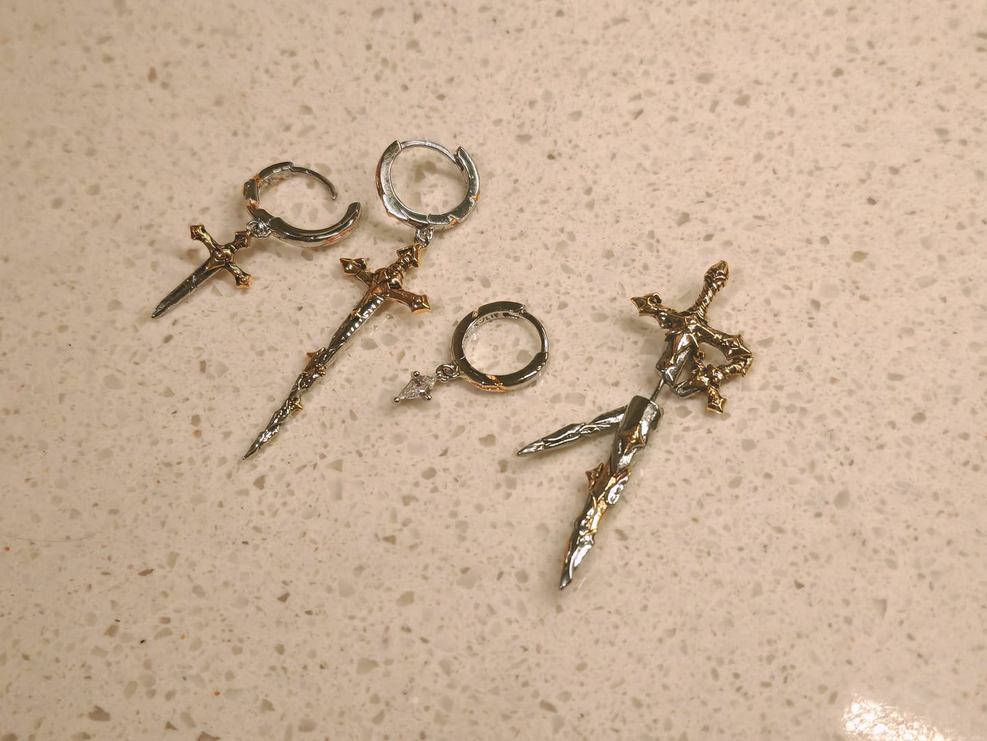 Customer photo review of "Knight's Oath" 18K Gold Plated Sword Dangle Hoop Earrings