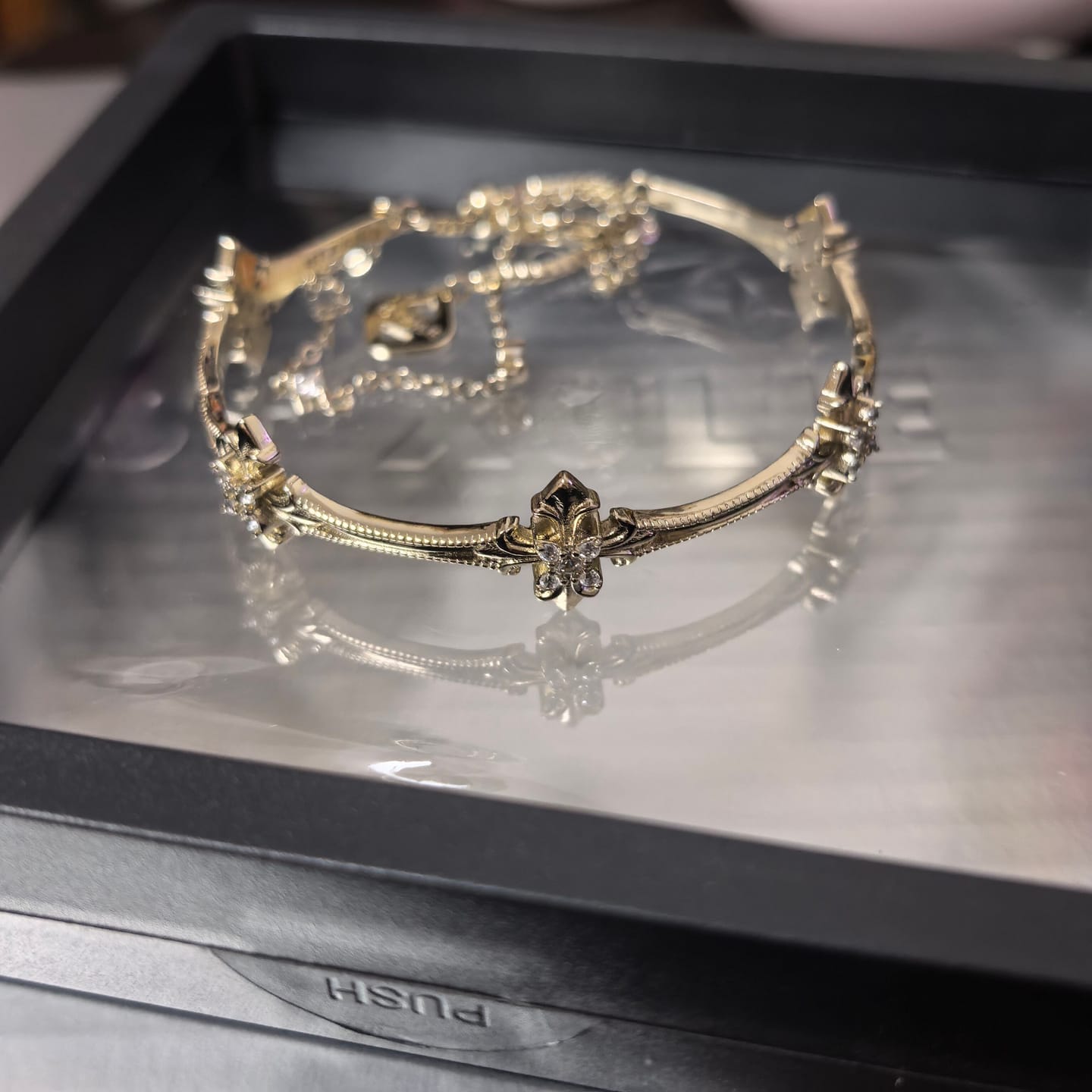 Customer photo review of "Bastet" 14K Gold Plated Vintage Iris Charm Bracelet, Zirconia
