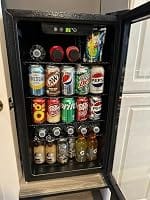 Customer photo review of Simzlife 4.5 Cu.ft Beverage Refrigerator and Cooler, 145 Can Mini fridge with Glass Door for Soda Beer Wine, Small Drink Dispenser with Digital Adjustable Thermostat for Home Office Bar