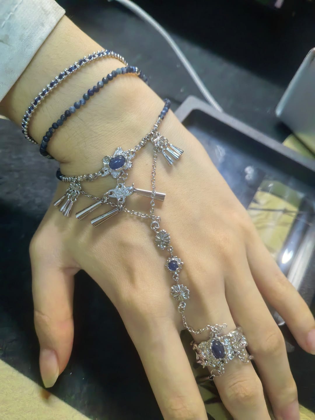 Customer photo review of "MIAO" Platinum Plated Blue Stone Hand Chain Bracelet