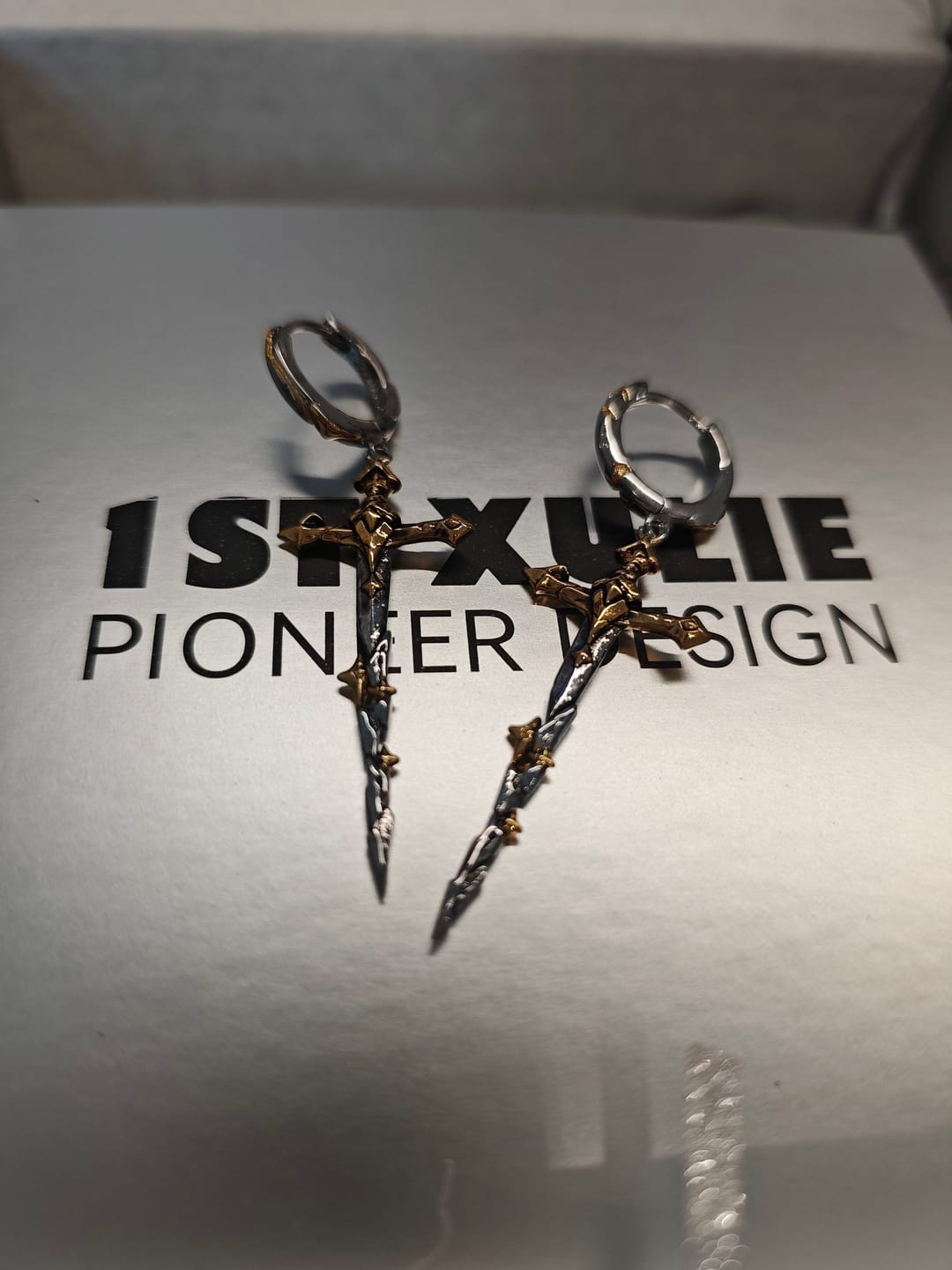 Customer photo review of "Knight's Oath" 18K Gold Plated Sword Dangle Hoop Earrings
