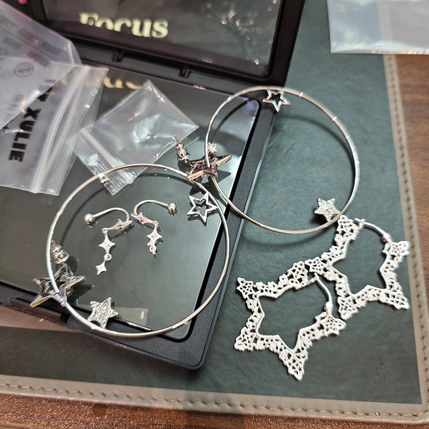 Customer photo review of "STARLIGHT LACE" Platinum Plated Rococo Star Statement Hoop Earrings
